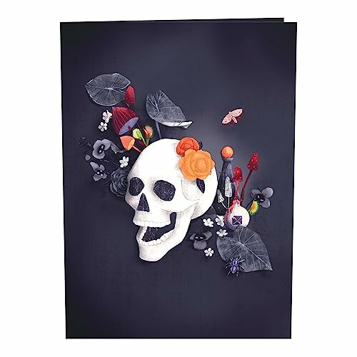 Artistic skull adorned with flowers and leaves on dark background