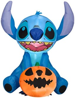 Blue alien character with Halloween pumpkin