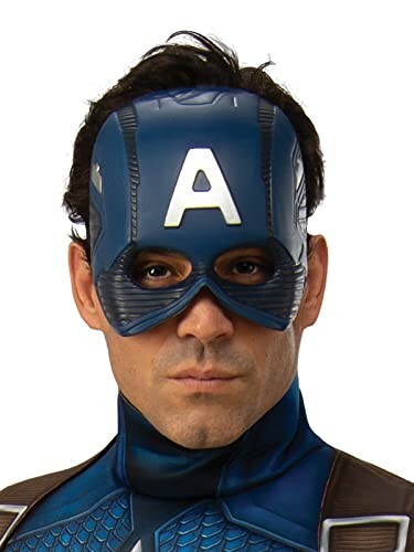 Person wearing a blue superhero mask with an 'A' on it.