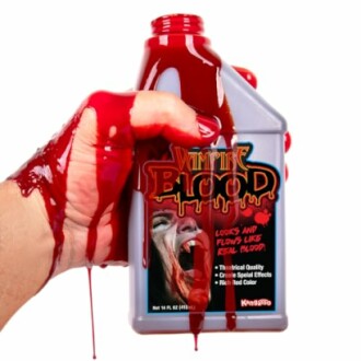 Hand holding a bottle of vampire blood prop with red liquid spilling out.