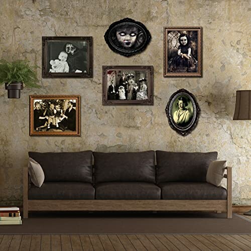 Living room with dark sofa and vintage eerie family photos on the wall.