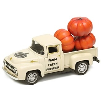 Model vintage truck loaded with pumpkins